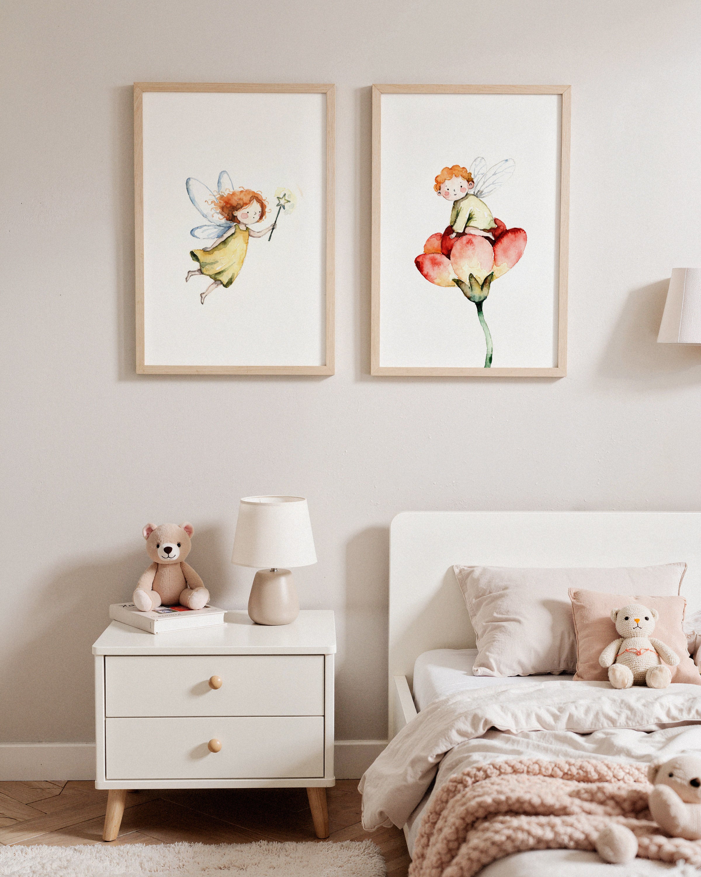 Children's bedroom with framed fairy art on the wall, teddy bear, and nightstand.