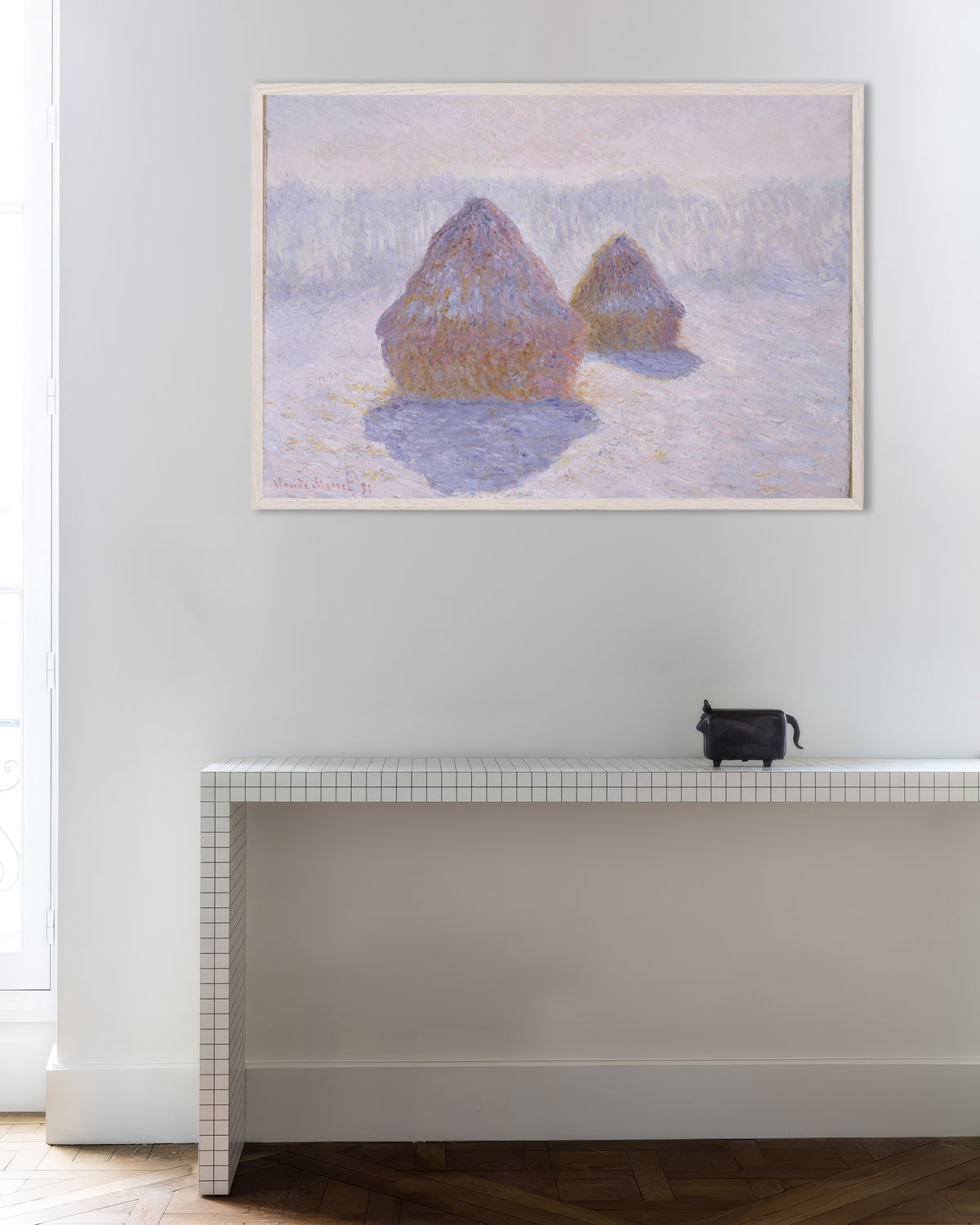 Poster of Haystacks, Effect of Snow and Sun (1891) by Claude Monet, with white wooden frame