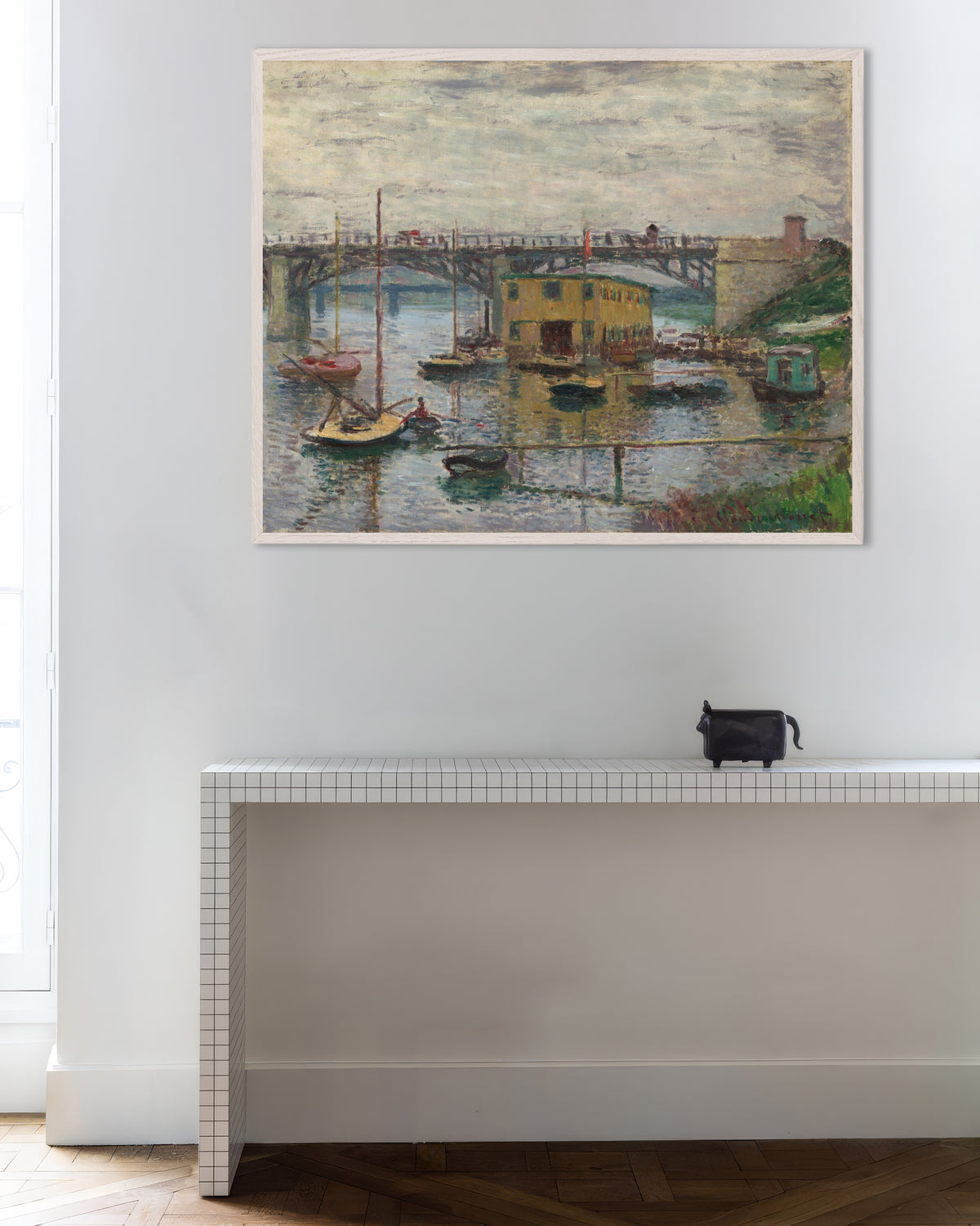 Poster of The Bridge at Argenteuil on a Gray Day (c. 1876) by Claude Monet, with white wooden frame