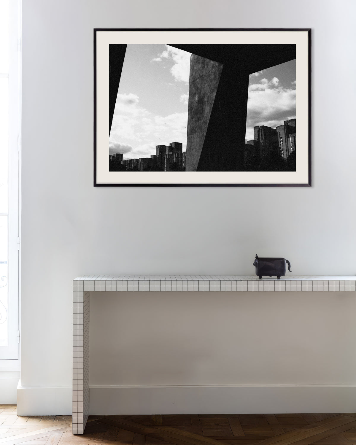 Poster of City Seen Between Concrete Pillars, with metal frame