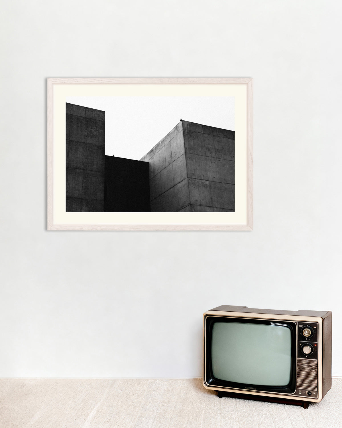 Poster of Two Concrete Blocks and a Bird, with white wooden frame