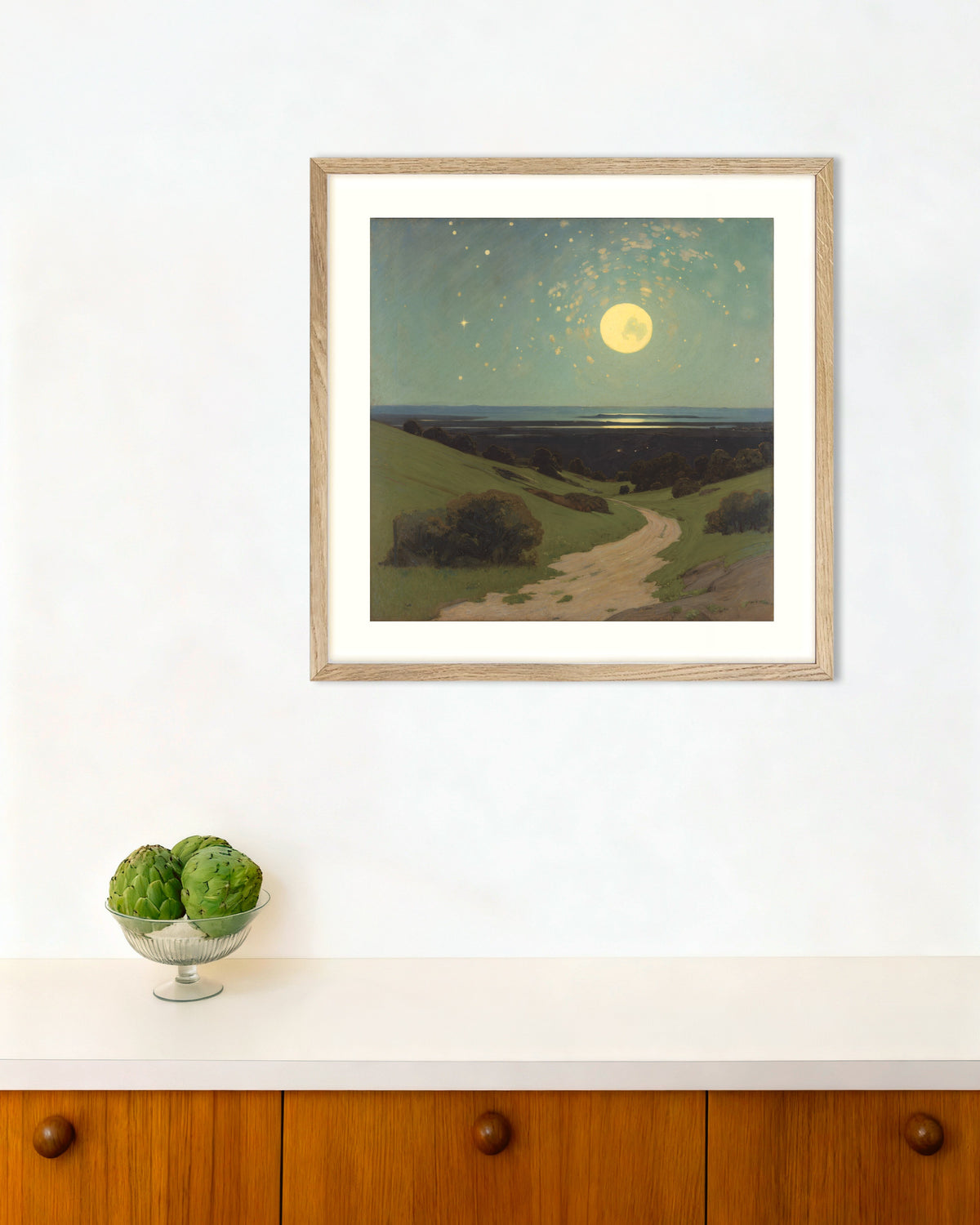Full Moon Over the Hills poster in a natural oak frame